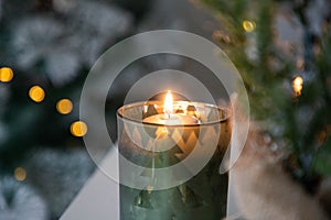 burning Christmas candles and bokeh light