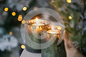 burning Christmas candles and bokeh light