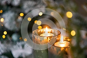 burning Christmas candles and bokeh light