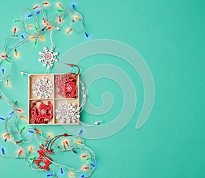 Burning christmas garland on a white wire with colorful lights