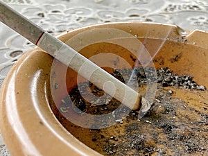 A Burning Cigarette on an Ashtray