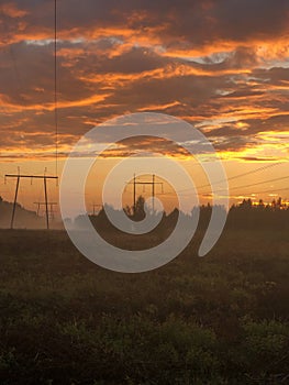 Burning clouds over field