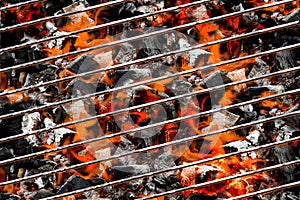 Burning coals in barbecue photo