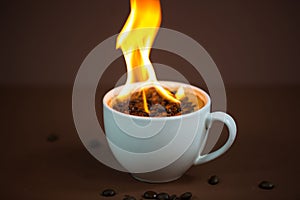 Burning coffee beans in a coffee cup