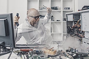 Burning computer on the technician desk