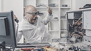 Burning computer on the technician desk