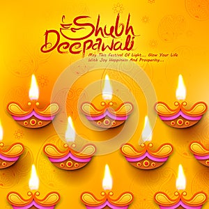 Burning diya on Diwali Holiday background for light festival of India with message in Hindi meaning Happy Dipawali photo