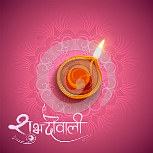 Burning diya on Diwali Holiday background for light festival of India with message in Hindi meaning Happy Dipawali photo