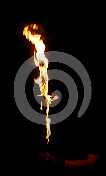 Burning fire stick in man hand