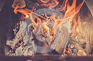 Burning firewood in barbecue/burning brazier with firewood