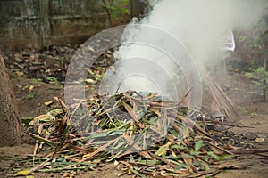 Burning garbage. grass and leaves burns in the garden. Fire and Smoke from during Burning of garden waste. Garbage in fire