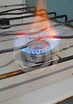 Burning gas on an old stove, blue fuel