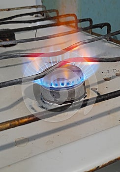 Burning gas on an old stove, blue fuel