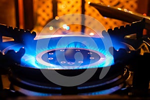 Burning gas stove. Blue flame of gas burner