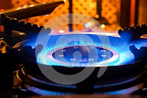 Burning gas stove. Blue flame of gas burner