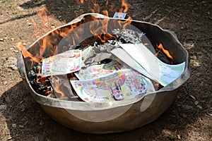 Burning Ghost money paper