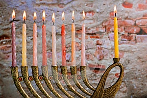 Burning hanukkah candles in a menorah photo