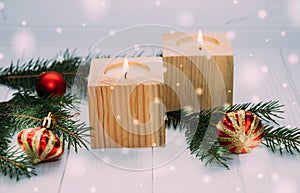 Burning holiday candles and Christmas toys. New Year`s traditional decor