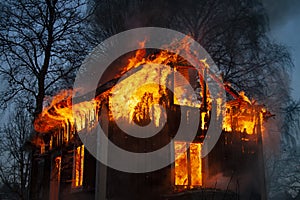 Burning house and fire fighters