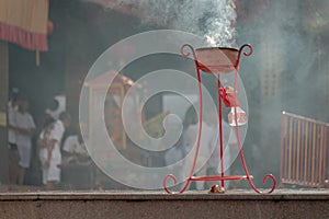 Burning incense, China Town.