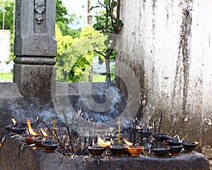Burning incense and oil in a Buddhist temple