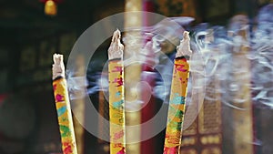 Burning incense sticks in Buddhist temple