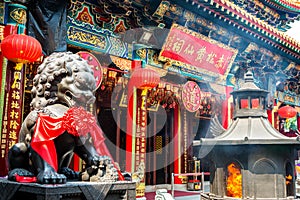 Burning incense in Wong Tai Sin Temple in Hong Kong