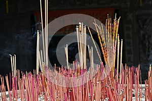 Burning incense and worship the gods in the buddhist temple in Qingyan Ancient Town, Guizhou province, China. The old town is.