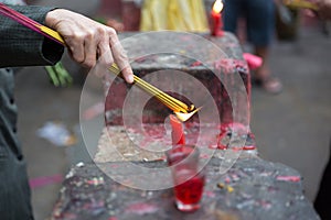 Burning joss sticks at pagoda, Saigon, Vietnam