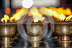 Burning Lamps in a Buddhist temple in Thimphu, Bhutan