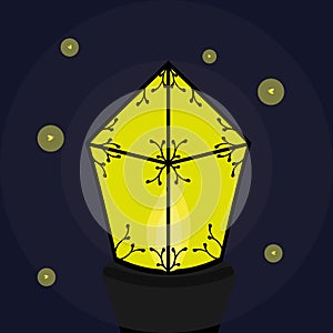 Burning lantern with fireflies
