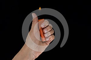 Burning lighter in female hand