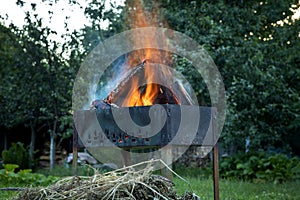 Burning logs in a brazier. Picnic time