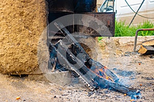 Burning logs of firewood in a clay oven