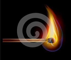 Burning match on a black background