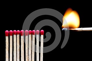 A burning match near other matches