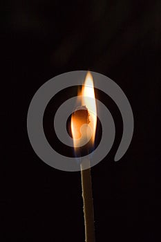 Burning matchstick in the dark