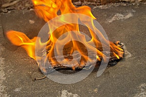 Burning a medical mask with a cleansing decontaminate fire