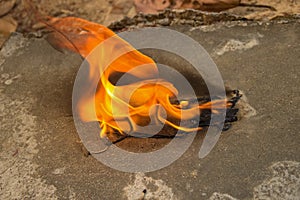 Burning a medical mask with a cleansing decontaminate fire