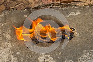 Burning a medical mask with a cleansing decontaminate fire photo
