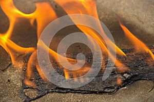 Burning a medical mask with a cleansing decontaminate fire photo