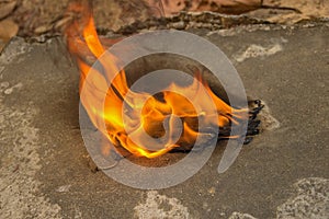 Burning a medical mask with a cleansing decontaminate fire photo