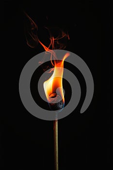 Burning Metaphors: A Closeup of a Lit Match and Dressed Garment