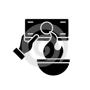 Burning money black glyph icon