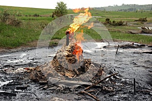 Burning natural gas in old oil wells