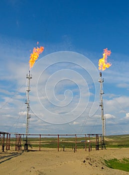 Burning oil gas flares