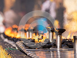 Burning oil lamps at the Shwedagon Pagoda