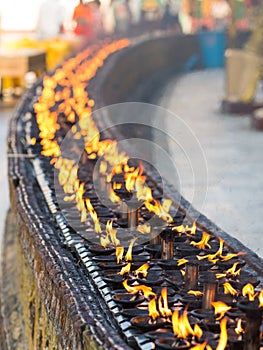 Burning oil lamps at the Shwedagon Pagoda