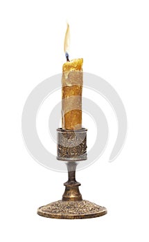 Burning old candle vintage bronze candlestick