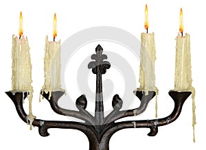 Burning old candle vintage bronze candlestick. Isolated On White Background.